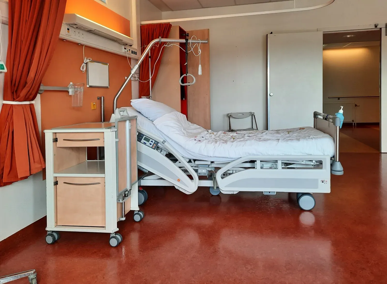 A clean, quiet room with an adjustable bed