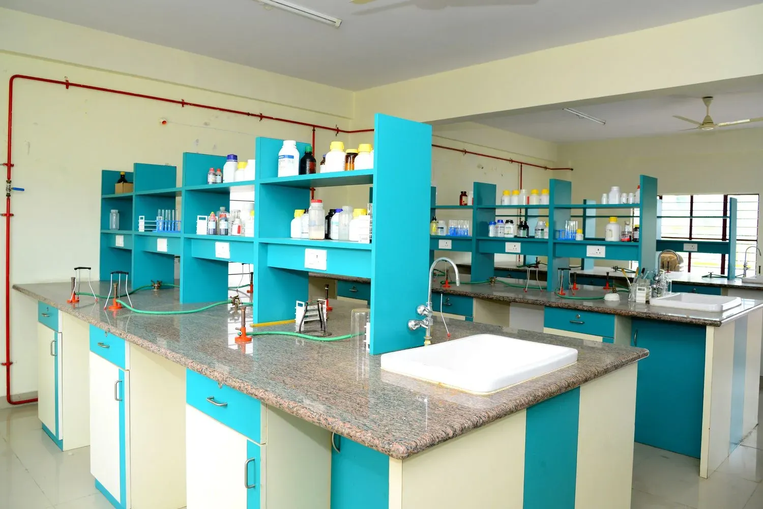 A chemistry lab workbench with taps and glassware