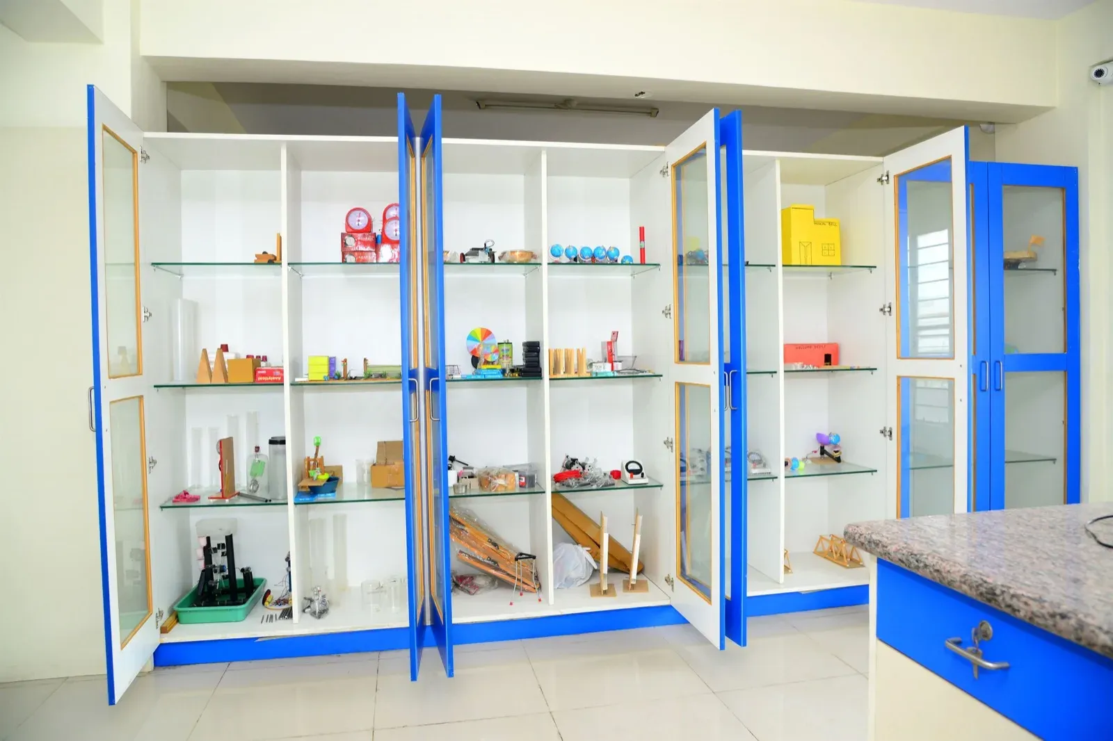 A lab equipment cabinet with science apparatus