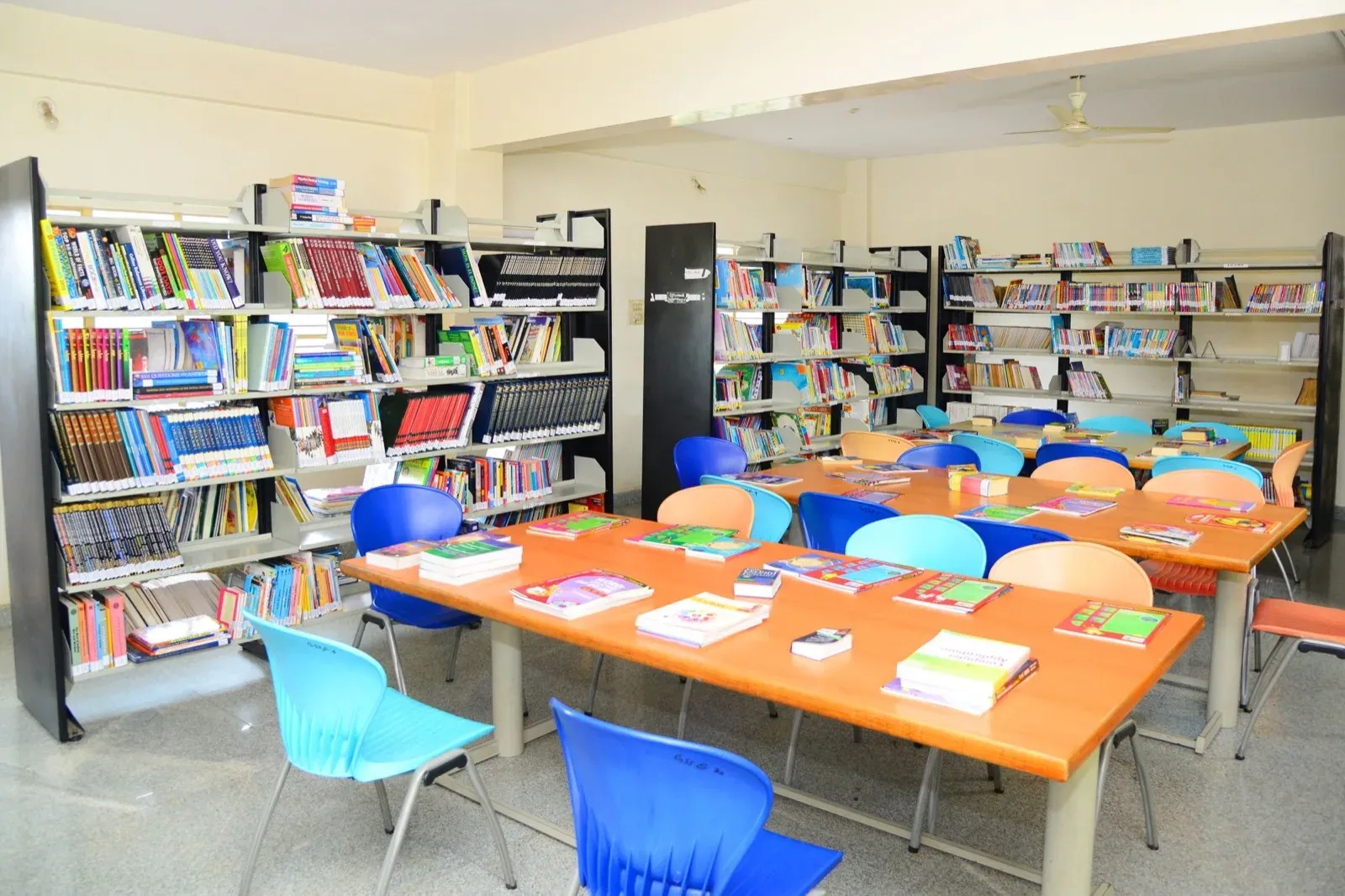 Bookshelves and a reading table in the school library