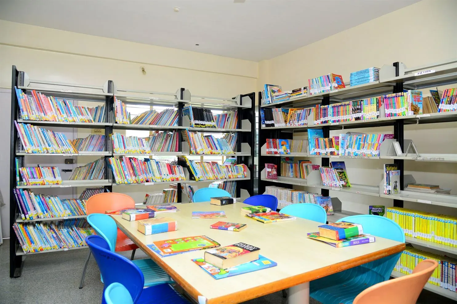 Students seated at a table in the school library